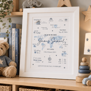 Personalised baby birth print with blue and green world map design in a white frame.