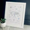 Personalised baby birth print with world map in blue and green foil design.