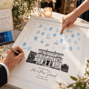 Personalised wedding fingerprint guest book with blue ink fingerprints and a venue illustration.
