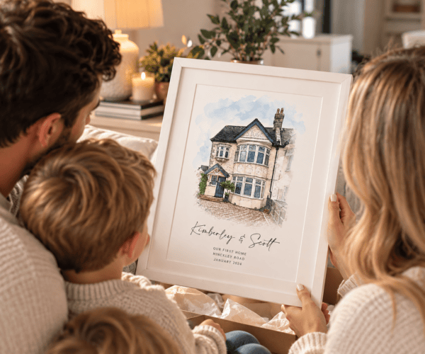 Family viewing a personalized watercolor house portrait from a photo.