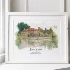 Watercolor painting of historic houses by a river with greenery.